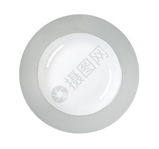 灰色圆边板白色汤盘镶边圆形充电器板轮缘餐具高架背景图片