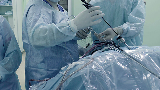 腹部的拉帕罗斯外科手术保健内窥镜乐器蓝色工具手套卫生诊所工作服护士图片