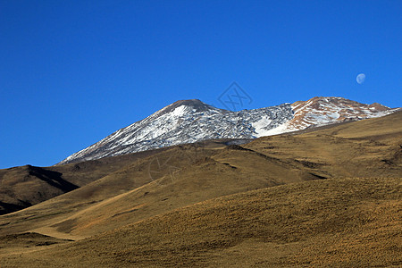 阿根廷 满月的雪覆盖火山特罗门阴天雪山蓝色雪景环境首脑冒险顶峰悬崖月亮图片