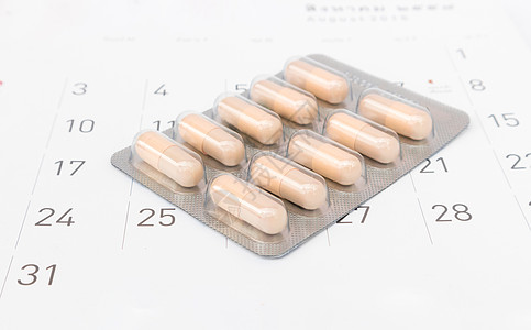 与日历背景日期 医疗保健和避孕药检查有关的紧闭避孕药片自由药品药理制药预防药物处方控制经期排卵图片