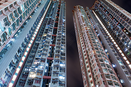 夜间住宅楼 晚上住房摩天大楼民众日落景观城市建筑公寓人口密度图片