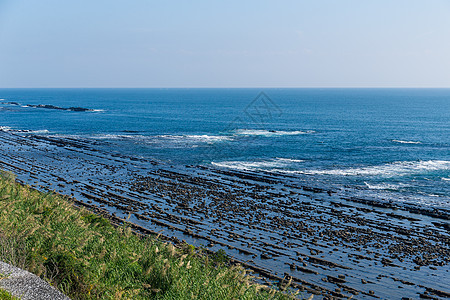 青岛岛海岸地平线海浪包围旅行神社海滩晴天海岸线岩石宗教图片