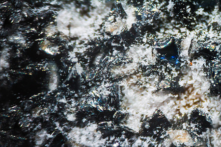 显微镜下的黑色指甲锉外星人岩石塑料宏观指甲水晶世界行星石头宝石背景图片