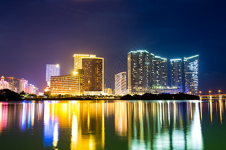 夜间澳门市日落反射港口景观城市旅行地标摩天大楼建筑戏剧性图片