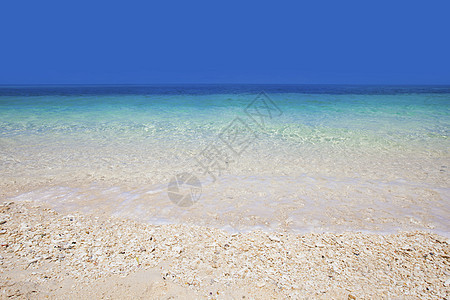 沙沙滩上的海浪冲浪天空蓝色海洋波纹阳光支撑海岸海岸线热带图片