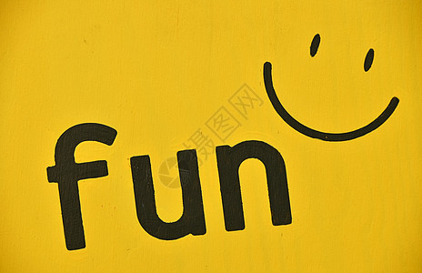Word FUN 和在黄色上涂画的微笑图标图片
