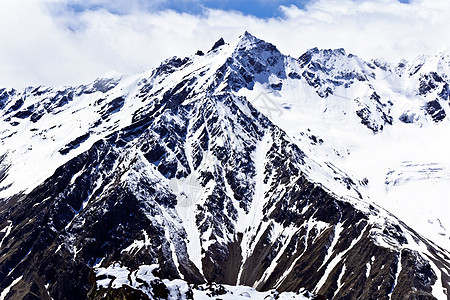 高加索山脉在寒风雪下高度冻结爬坡冰川悬崖全景天空风景季节地块图片