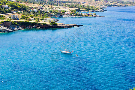 希腊赞特岛的地貌景观目的地帆船胜地悬崖图标游艇支撑树木太阳天空图片