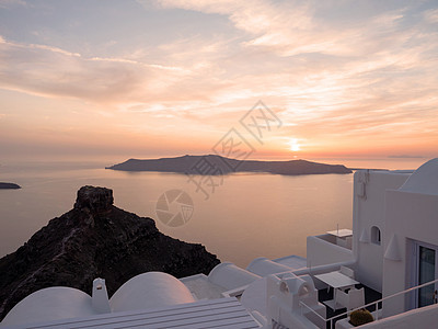圣托里尼岛美丽的景色日落反射旅游房子景点悬崖火山白色太阳旅行图片