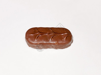 白面糖食品上的棕色巧克力奖彩条甜点手指美食饮食酒吧牛奶坚果诱惑可可赏金背景图片