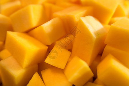 胡桃南瓜或芒果立方体正方形橙子壁球烹饪黄色炊具食物图片