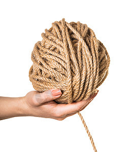 在女性手中缠结的绳索棉布纠纷细绳手工棕色缠绕纤维线圈卷轴圆形图片