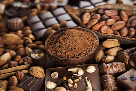 肉桂 黑巧克力加牛奶和糖果甜甜地面营养食物桌子诱惑木头宏观小吃巧克力粉末图片