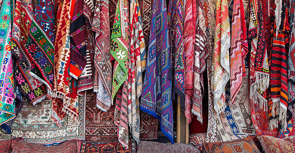 街头市场的东方地毯小地毯手工装饰文化零售挂毯织物编织风格纺织品图片