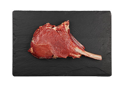 特写生牛肉托马霍鹰牛排白色木板石板肋骨烹饪厨房红色黑板牛肉肋眼图片