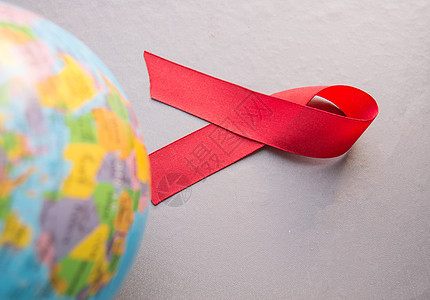 12月1日世界艾滋病日 以红色丝带环绕世界感染地球免疫斗争帮助疾病全世界治疗监视团结图片