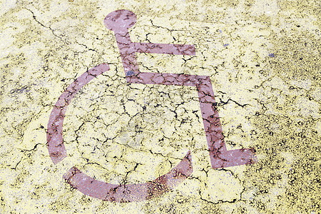 沥青上的残疾人标志公园椅子轮椅人士街道工作安全残障交通城市图片