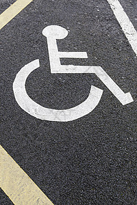 沥青上的残疾人标志公园蓝色信号车站残障警告线条障碍网络人士图片