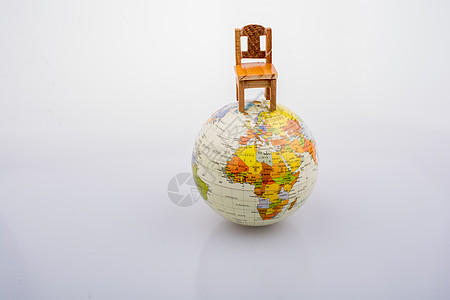 模拟地球顶端的座椅经济椅子全球图表战略国际行星全世界指导世界背景图片