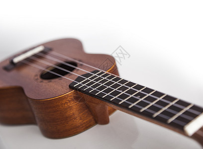 棕色的乌鲁勒吉他歌曲艺术细绳民间乐器白色声学木头国家旋律图片