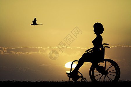 坐在轮椅上的女孩看着日落图片