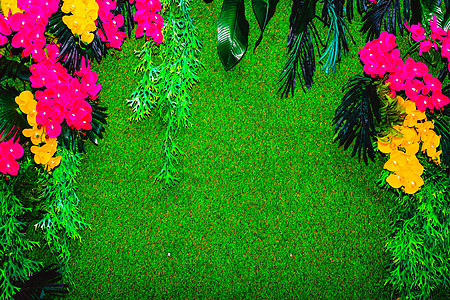 鲜花和草地由人工材料制成的鲜花构成的背景背景成分紫色花序树叶花园兰花花瓣字母植物模仿草地背景
