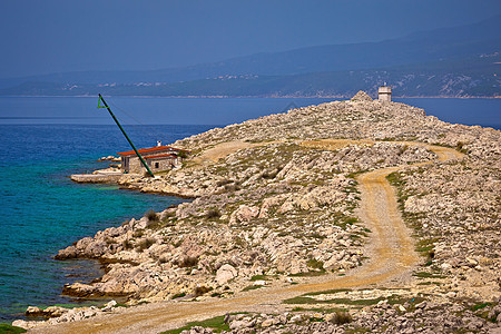 Krk石岩沙滩岛和Silo灯塔风景图片