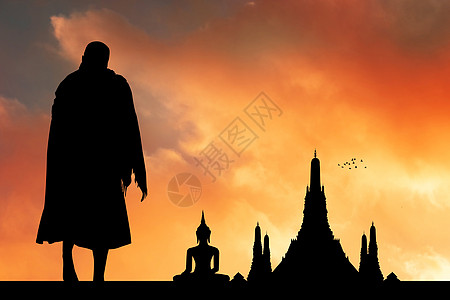 日落时寺庙的佛教僧侣插图男人供品佛教徒艺术文化祷告宗教仪式橙子图片