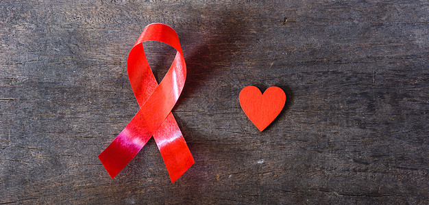 支持艾滋病毒 艾滋病和红心活动药品机构治愈预防彩虹斗争世界木头丝带图片