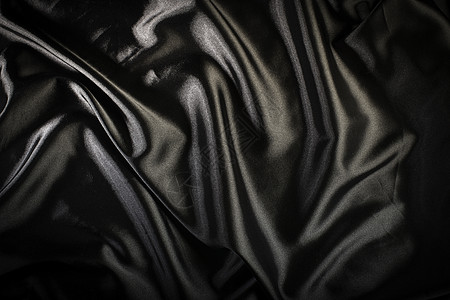 闪亮的黑色缎面面料材料纺织品布料奢华波浪状衣服曲线丝绸海浪图片