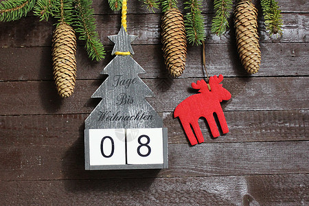 圣诞节倒计时 文本天数直到圣诞节装饰时候数字冬令贺卡木板倒数杉枝枝条木头图片