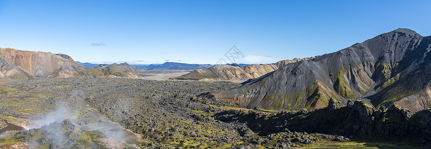 在的徒步旅行山顶高架顶峰山脉日光地标山峰风景横向火山背景图片