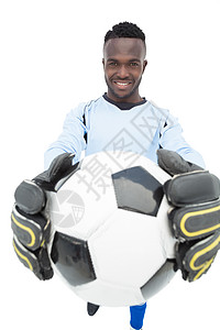 一个微笑的英俊足球运动员的肖像男人扇子观众幸福快乐男性运动支持者活动黑色背景图片