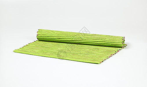 带丝的绿色草地垫纺织品桌布棉布肋骨折叠编织织物台垫图片