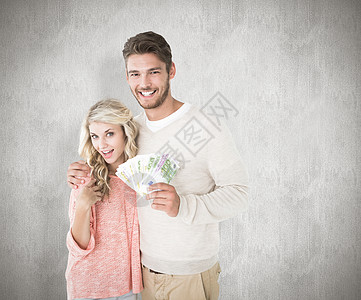有吸引力的情侣闪现现金的复合形象男人富裕经济墙纸微笑快乐笔记储蓄夫妻男朋友图片