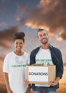 志愿人员携带捐赠箱的数码综合体数字组合社会服务衣服社区帮助捐赠太阳志愿者团结日落社区服务图片