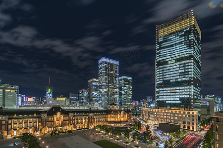 东京夜景东京火车站Marunouchi一侧夜景全景曲目红砖干线太阳阴影运输建筑物蓝天商业铁路背景