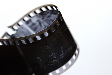 在螺旋的老黑白影片在白色背景 老复古片 非常老的黑白电影照片体重摄影相机投影仪古董边界磁带艺术摄影师图片