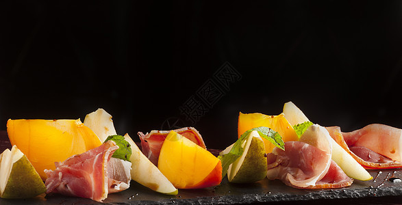 帕尔马火柿子自助餐橙子火炉火腿沙拉食物薄荷水果猪肉图片