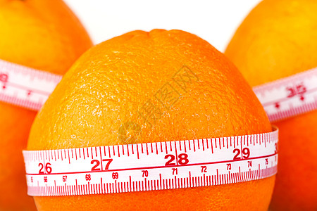 三个橙子配裁缝的标尺 橘子饮食 果实疗养维他命饮食有助于减肥重量食物果汁收藏饮料统治者水果图片