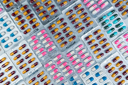 热水袋中多彩抗生素胶囊药丸的顶层景色禁忌症药品药片处方预算生产治疗蓝色制药产品图片