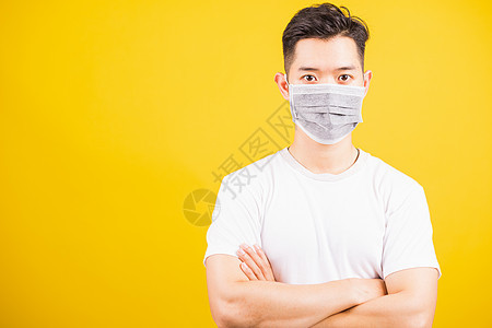 戴面罩保护细菌病毒并站立交叉的男子预防面具传染性疾病男性男人药品卫生感染肺炎图片