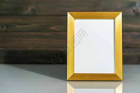 图片金框在桌子上装模作样白色甲板办公室小样金子风格空白框架装饰背景背景图片