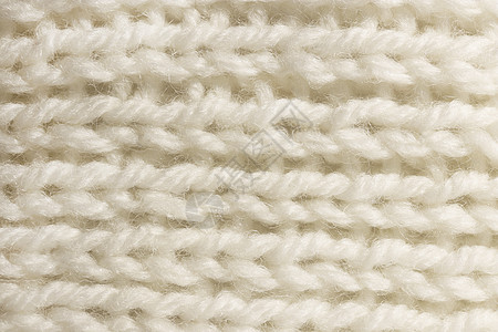 温暖的白色羊毛针织质地 水平沿编织钩针详细行 毛衣纺织背景 微距特写图片