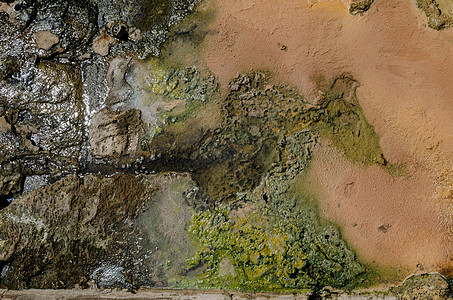温泉水流过的一个岩石地区详情橙子订金绿色环境混合物治愈石头地面黄色图片