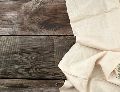 白色厨房毛巾折叠在O的灰色木制桌子上亚麻木头野餐装饰材料木板风格抹布控制板桌布图片