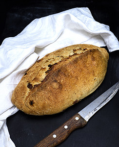 黑色表面白面面面粉叶乡村酵母白色小麦桌子包子食物早餐营养面包图片