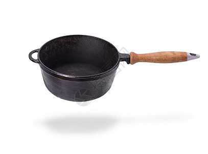 深黑的铁煎锅 用木制手柄厨具黑色炊具用具金属烹饪投掷白色厨房油炸图片