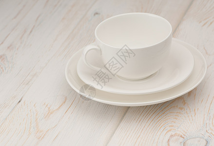 轻背景的杯子和茶碟盘子空白飞碟咖啡餐具茶壶制品茶碗用具陶器图片