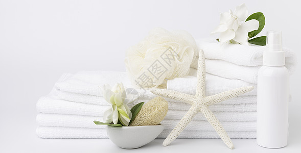 斯帕和保健概念设置成堆白毛巾Stt温泉瓶子香味横幅程序灰色治疗休息绿色栀子花图片